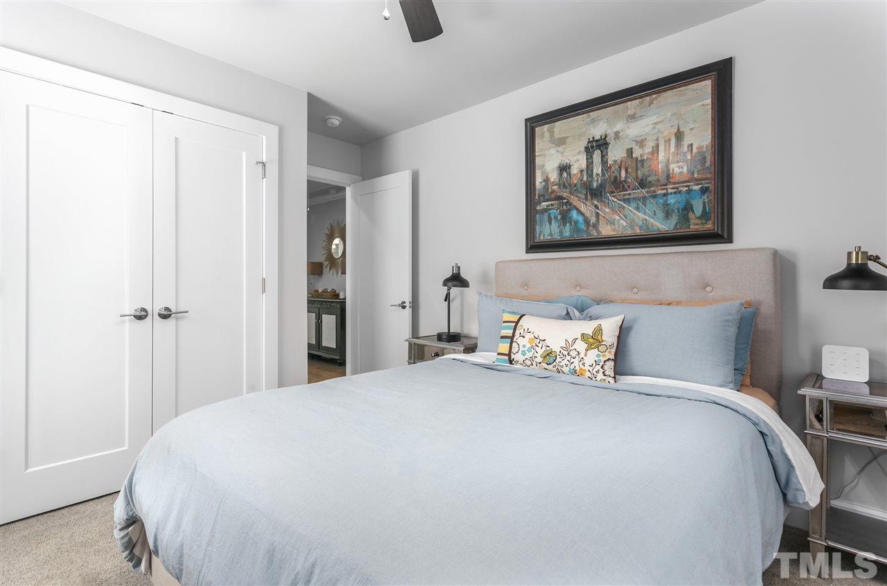 12 Hill Street Raleigh, NC 27610 - Photo 22 of 30 a bedroom with a bed and wall painting