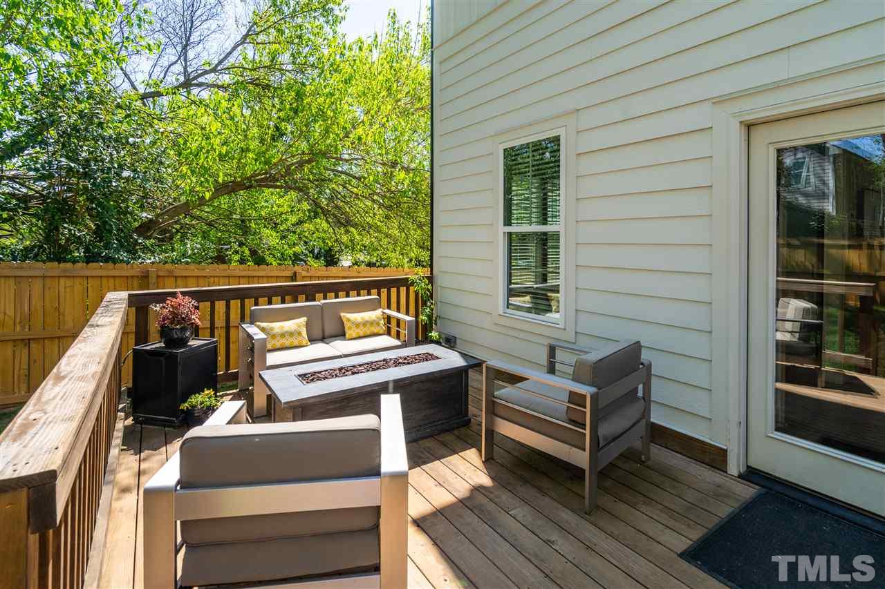 12 Hill Street Raleigh, NC 27610 - Photo 25 of 30 a roof deck with a couch and wooden floor