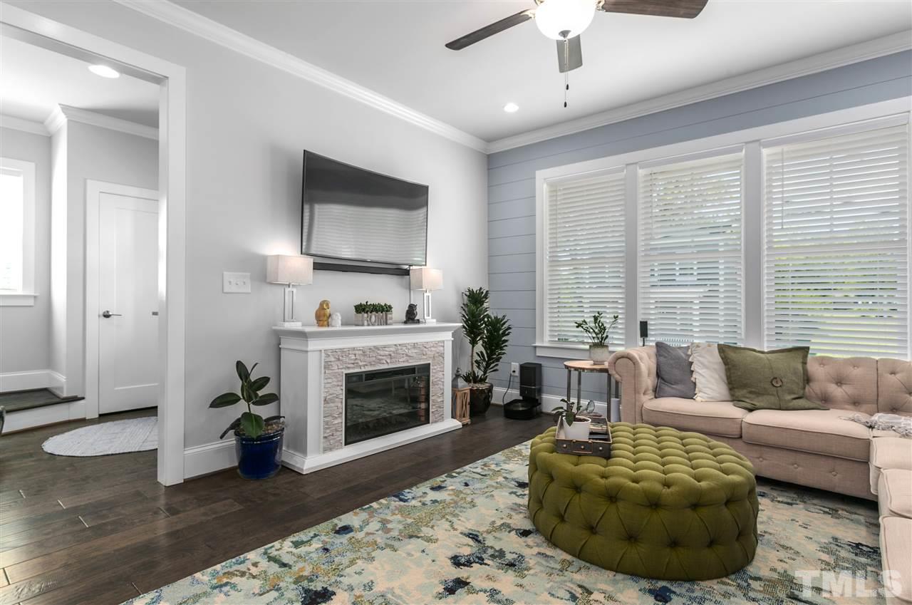 12 Hill Street Raleigh, NC 27610 - Photo 6 of 30 a living room with furniture and a fireplace