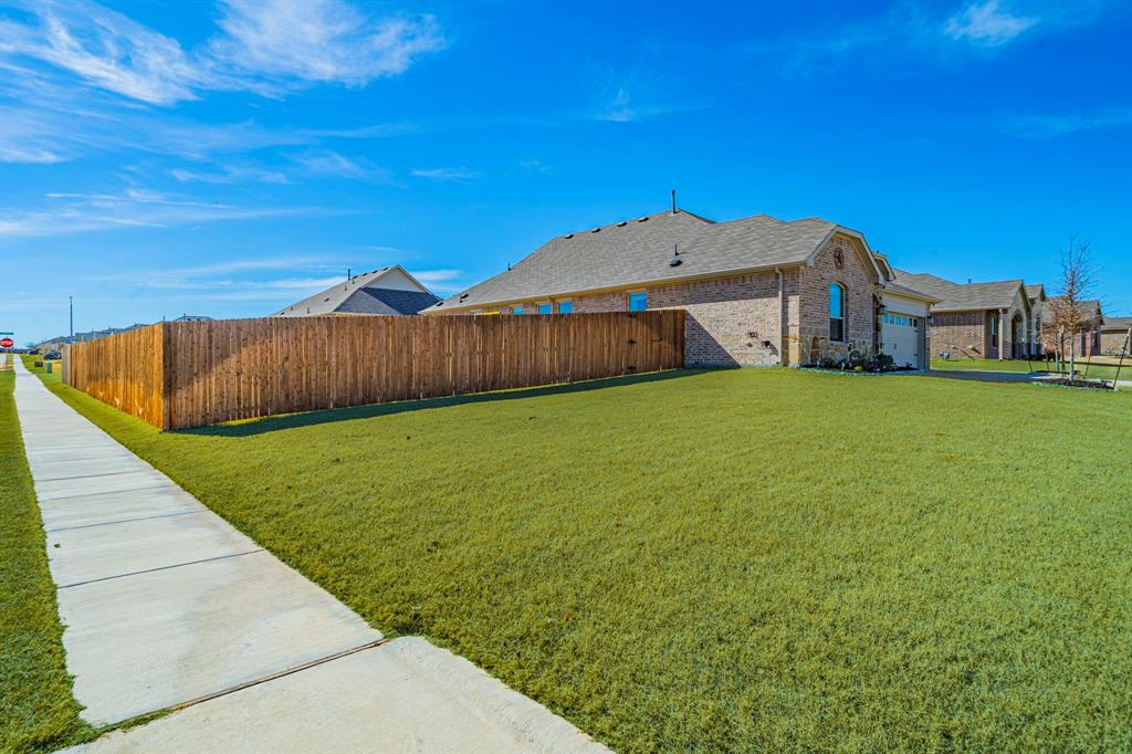 1240 Almond Road Azle, TX 76020 - Photo 18 of 26 a view of a backyard with a small pool