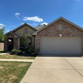 a view of backyard of the house