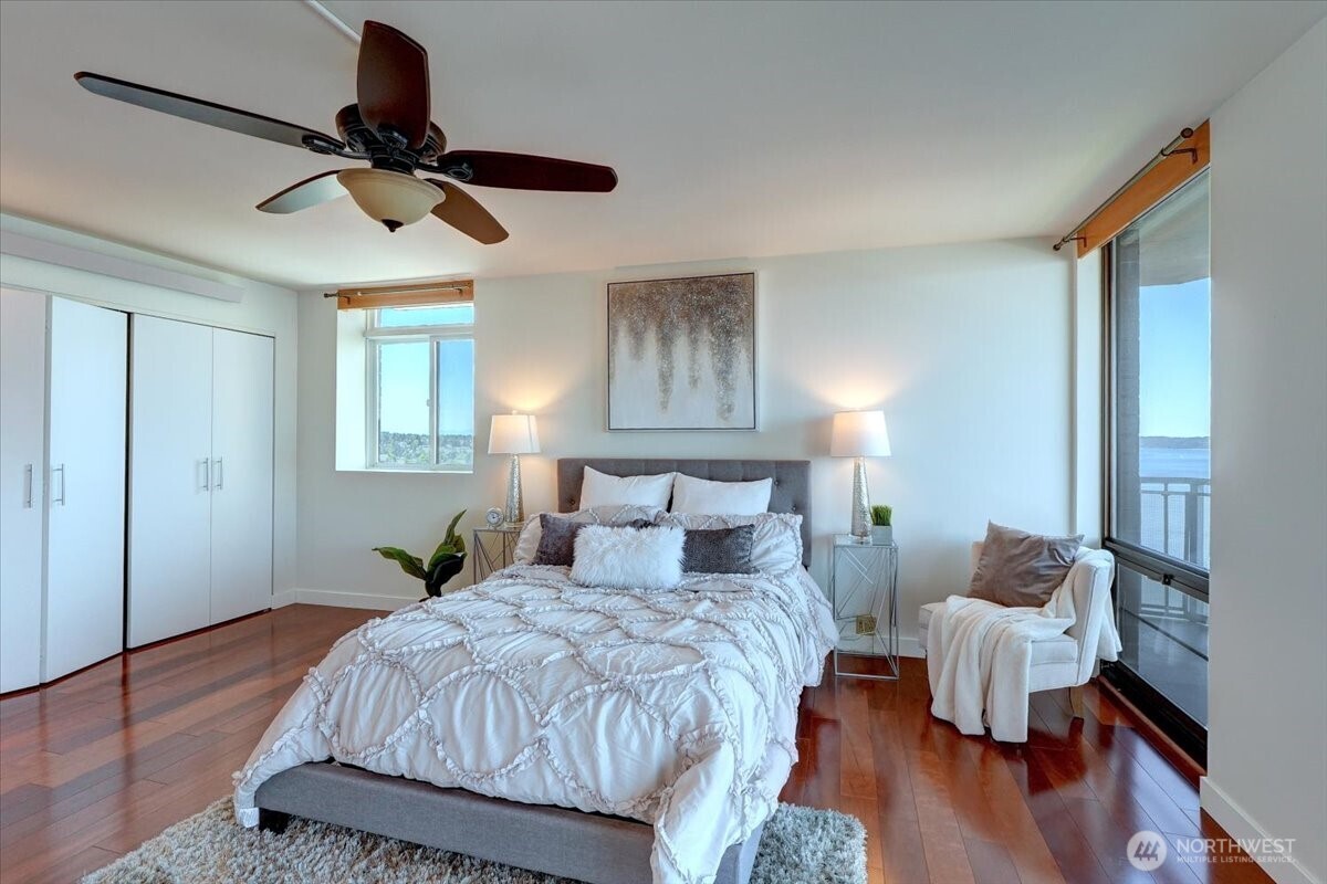 1 North Stadium Way, Unit 16 Tacoma, WA 98403 - Photo 21 of 39 a bedroom with a bed and wooden floor