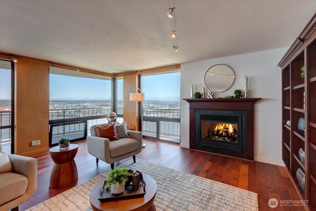 1 North Stadium Way, Unit 16 Tacoma, WA 98403 - Photo 5 of 39 a living room with furniture and a fireplace