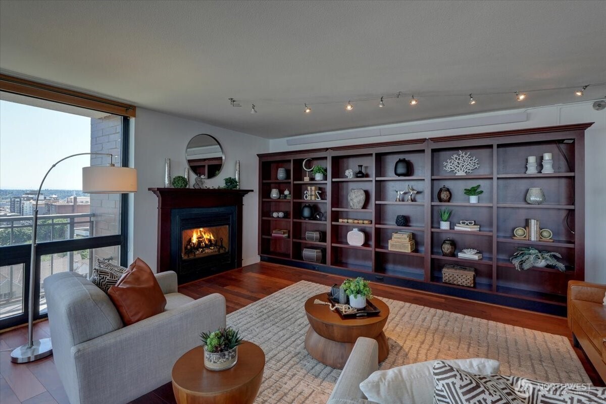 1 North Stadium Way, Unit 16 Tacoma, WA 98403 - Photo 7 of 39 a living room with furniture and a fireplace