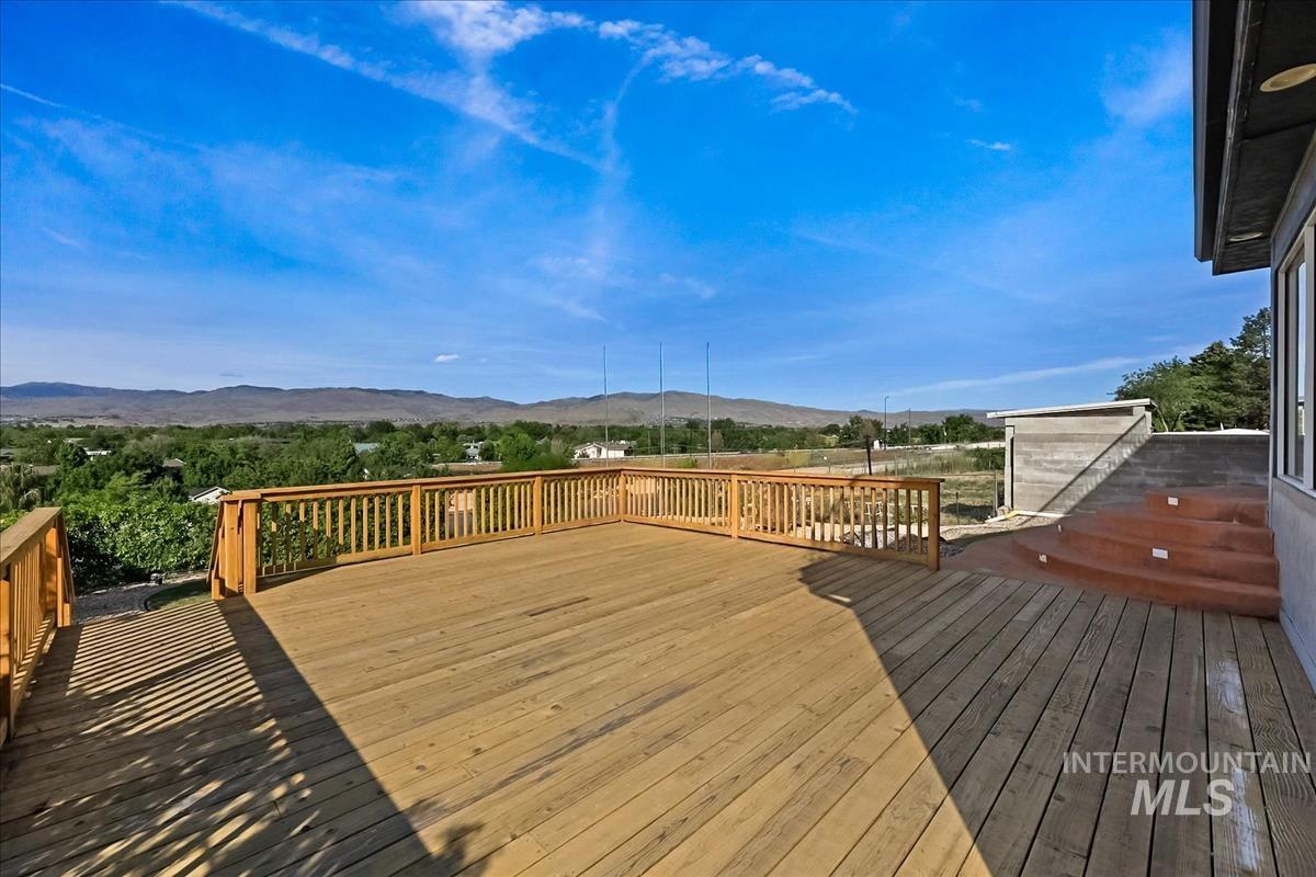 2804 West Sunrise Rim Road Boise, ID 83705 - Photo 48 of 50 Expansive wood deck with a natural finish, featuring a full wood railing system