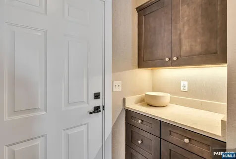 a bathroom with a sink and cabinets