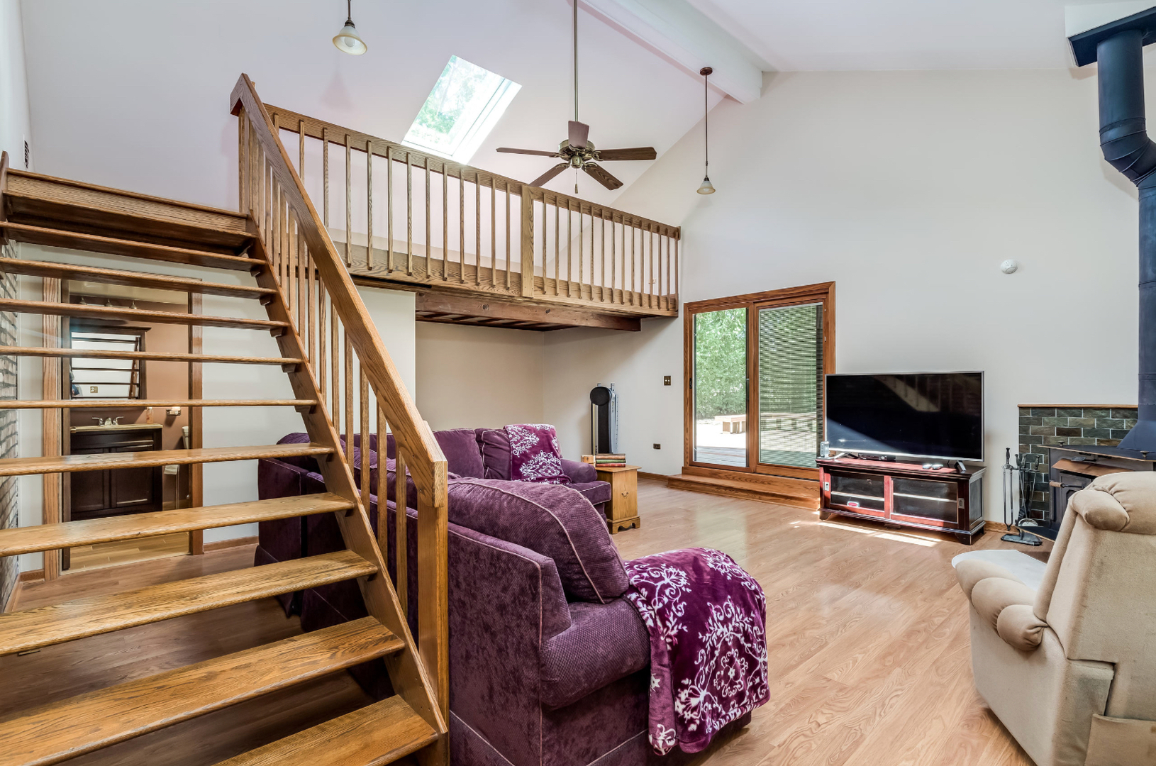 17-w072 Deerpath Road Wood Dale, IL 60191 - Photo 13 of 28 a living room with furniture or stairs and a flat screen tv