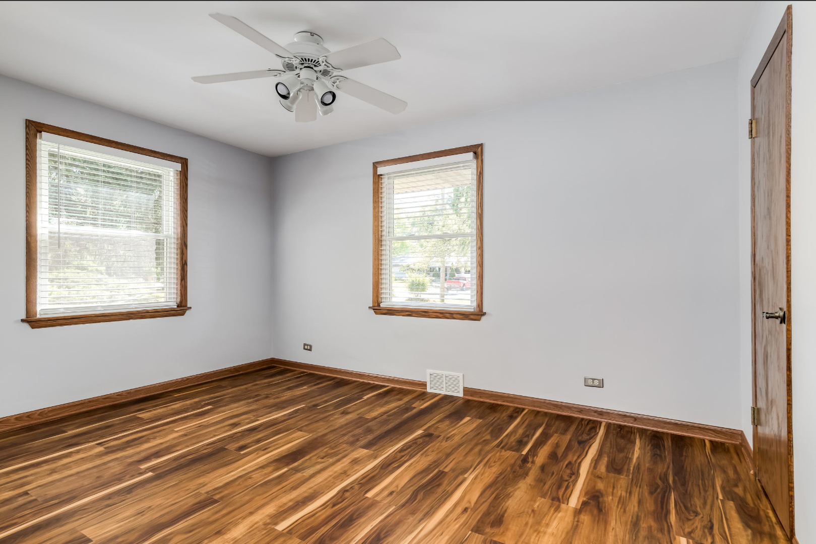17-w072 Deerpath Road Wood Dale, IL 60191 - Photo 21 of 28 a view of a room with wooden floor and natural light
