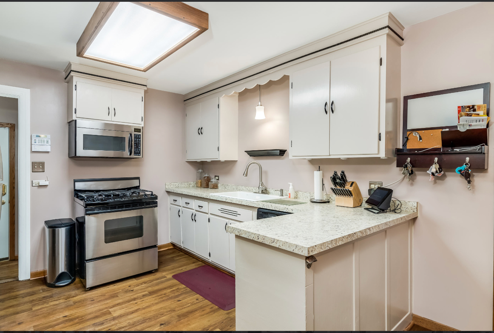 17-w072 Deerpath Road Wood Dale, IL 60191 - Photo 10 of 28 a kitchen with a stove a sink and a microwave