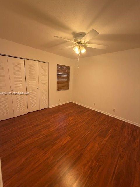 21601 Coronado Avenue Boca Raton, FL 33433 - Photo 8 of 10 a view of empty room with wooden floor and fan