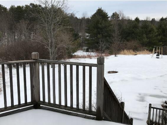 33 Montgomery Road Windham, ME 04062 - Photo 28 of 29 Deck and view of part of the backyard.