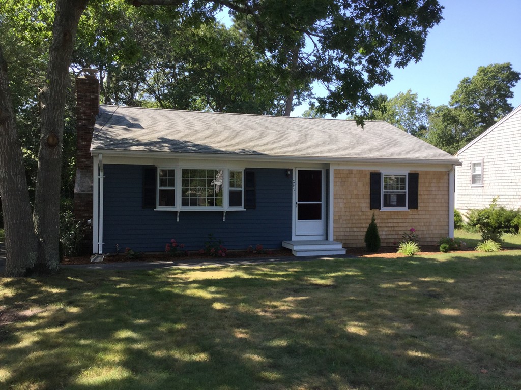 241 Megan Road Barnstable, MA 02601 - Photo 1 of 23 a view of a house with a yard in the background