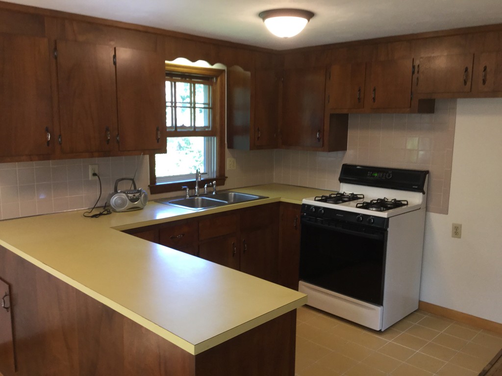 241 Megan Road Barnstable, MA 02601 - Photo 14 of 23 a kitchen with a sink and a stove top oven