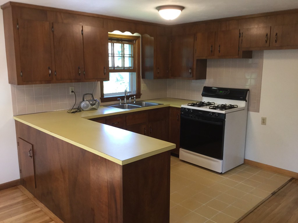 241 Megan Road Barnstable, MA 02601 - Photo 15 of 23 a kitchen that has a sink and a stove in it
