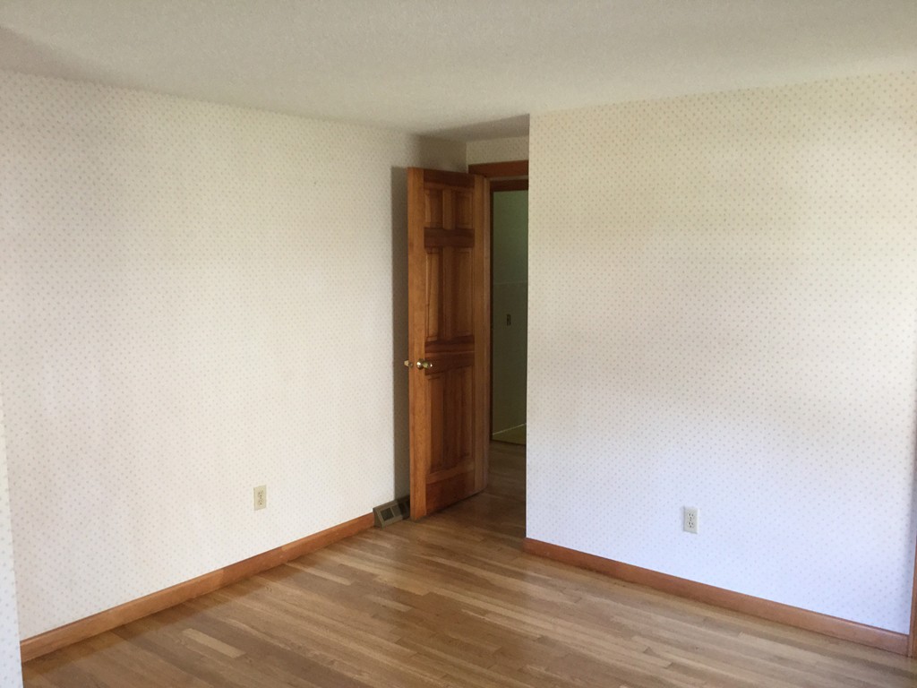 241 Megan Road Barnstable, MA 02601 - Photo 17 of 23 a view of an empty room with wooden floor