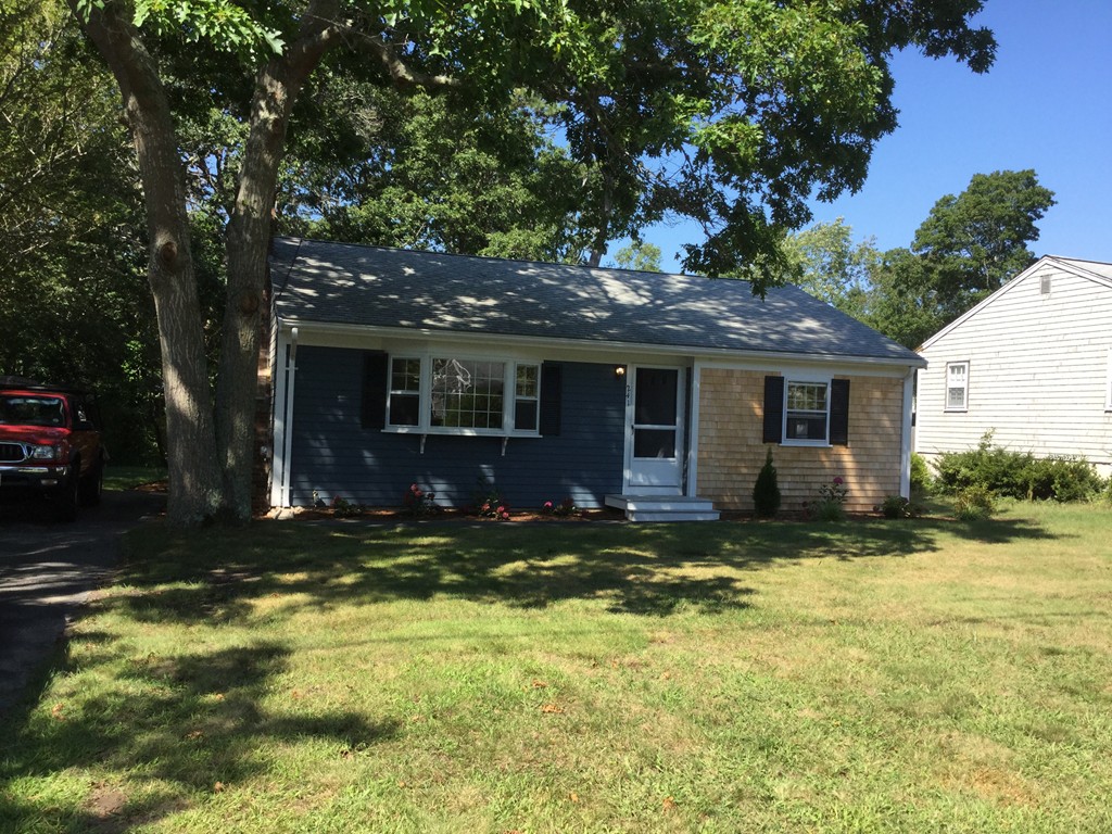 241 Megan Road Barnstable, MA 02601 - Photo 20 of 23 a view of a house with a yard and large tree