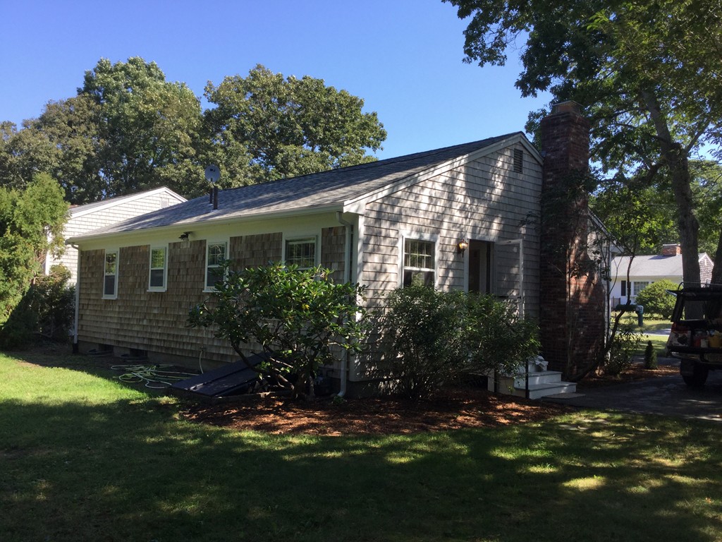 241 Megan Road Barnstable, MA 02601 - Photo 21 of 23 a backyard of a house with lots of green space