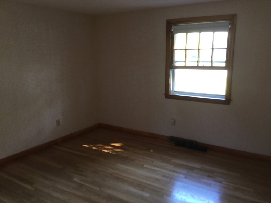 241 Megan Road Barnstable, MA 02601 - Photo 23 of 23 an empty room with wooden floor and windows