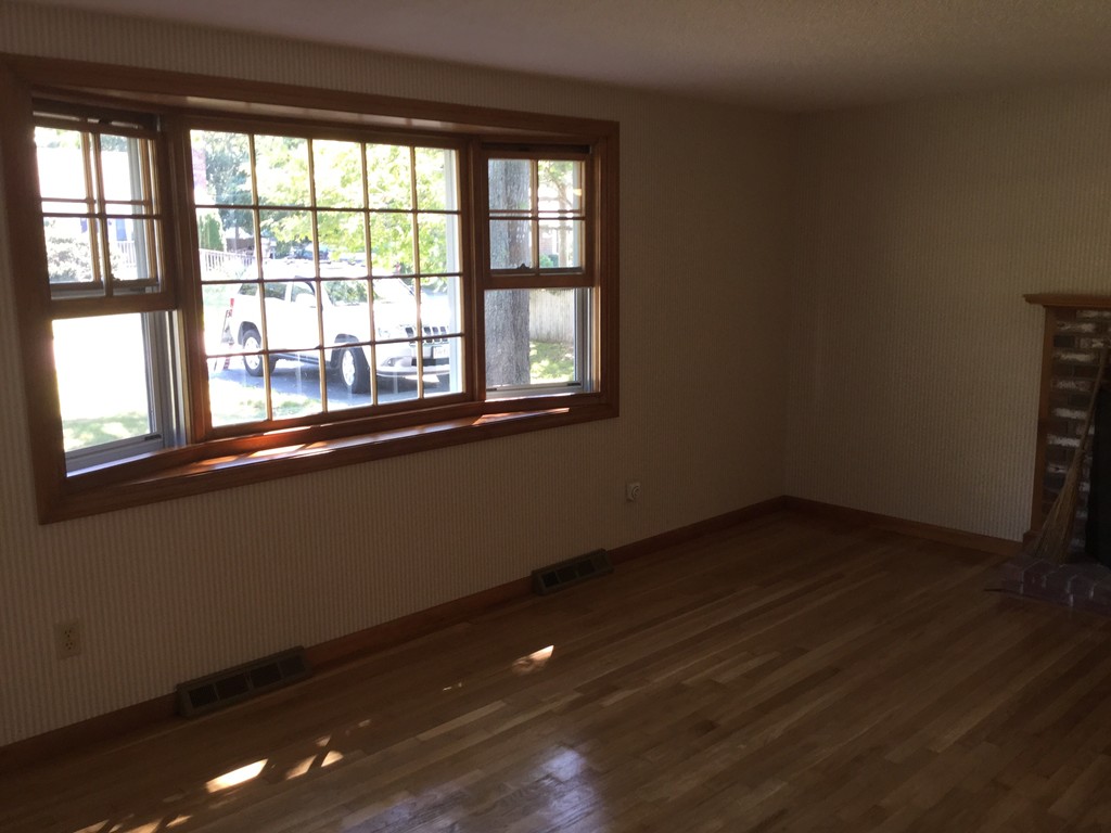 241 Megan Road Barnstable, MA 02601 - Photo 8 of 23 a view of an empty room with wooden floor and a window
