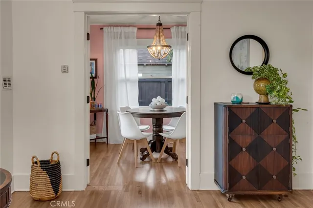 a view of a workspace with furniture and wooden floor
