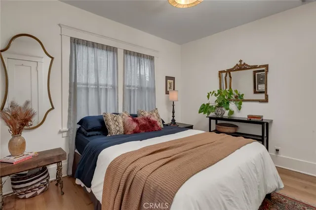 a bedroom with bed and a window