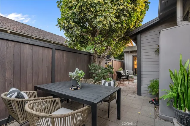 a view of a patio with a table and chairs