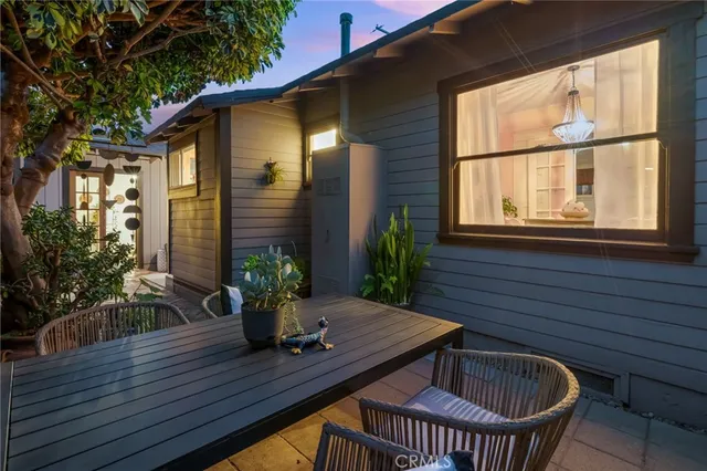 a view of a patio with a table and chairs