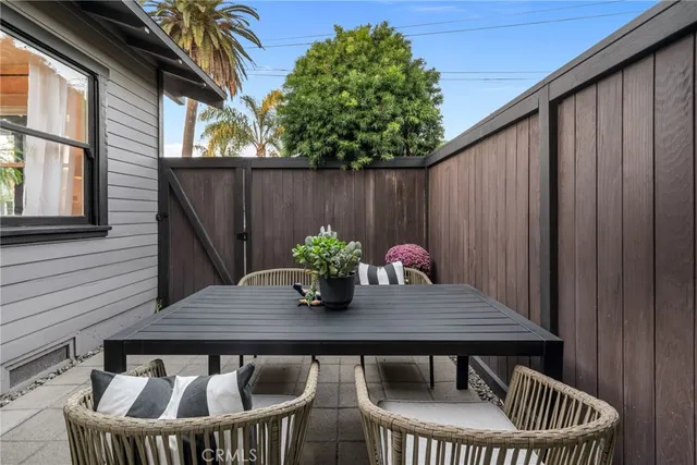 a view of outdoor space with a potted plant and dinning table and chair