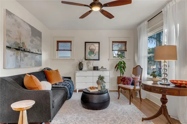 a living room with furniture and a lamp