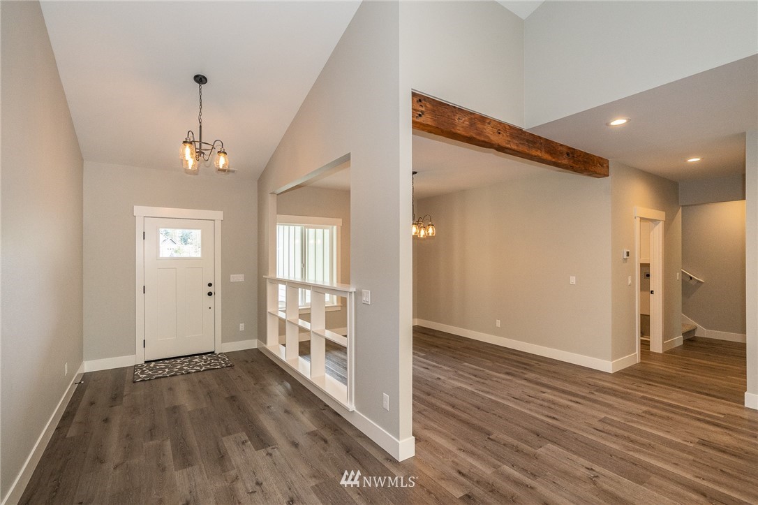 8414 James Road Southwest Rochester, WA 98579 - Photo 3 of 40 a view of livingroom with hardwood floor and window
