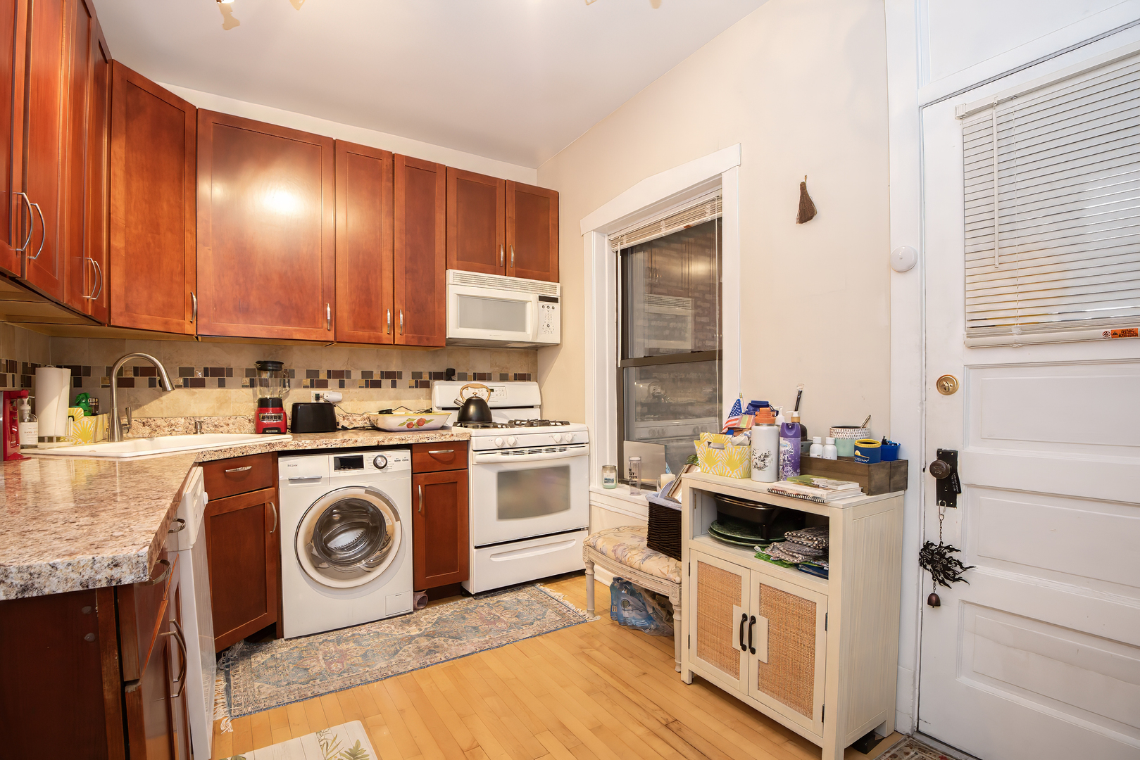 920 Wesley Avenue, Unit 1 Oak Park, IL 60304 - Photo 15 of 21 a utility room with cabinets washer and dryer