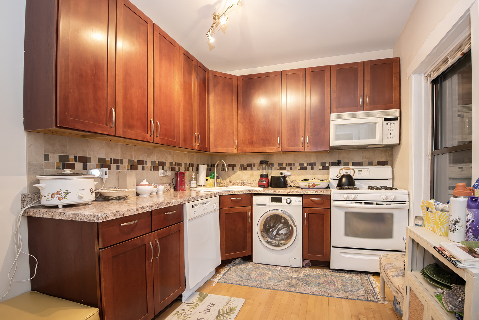 920 Wesley Avenue, Unit 1 Oak Park, IL 60304 - Photo 16 of 21 a kitchen with a sink a stove and cabinets