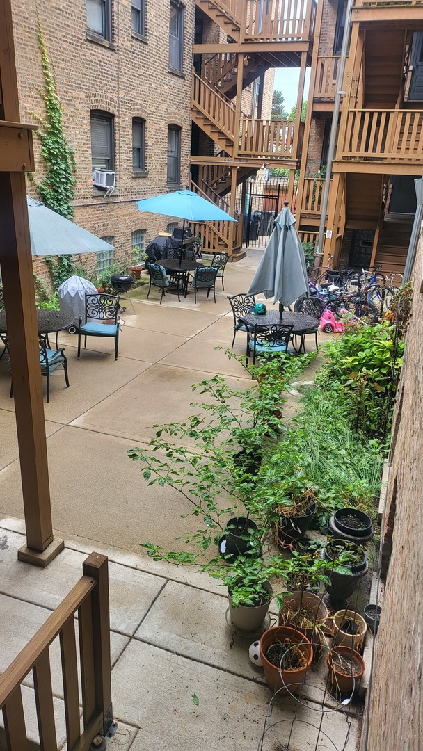 920 Wesley Avenue, Unit 1 Oak Park, IL 60304 - Photo 20 of 21 a view of a street with potted plants