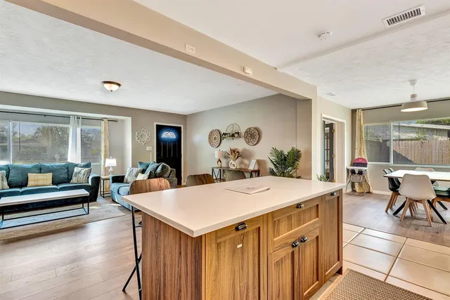 a view of a dining room with furniture window and outside view