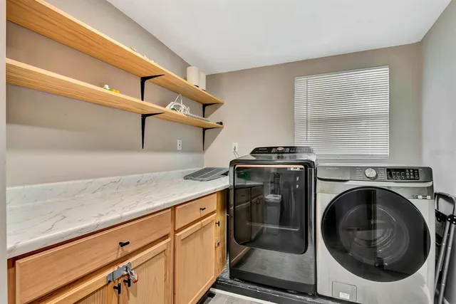 a utility room with dryer and washer