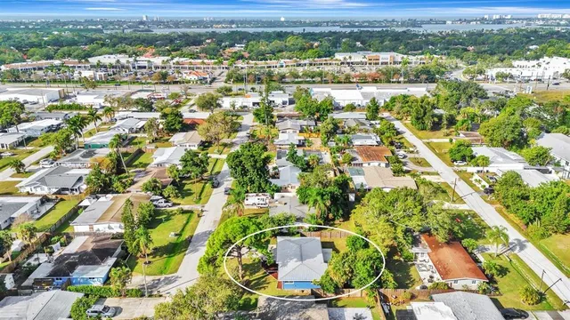 an aerial view of residential houses with outdoor space