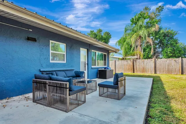 a outdoor living space with furniture and a garden
