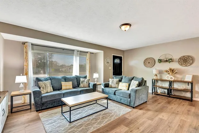 a living room with furniture and a table