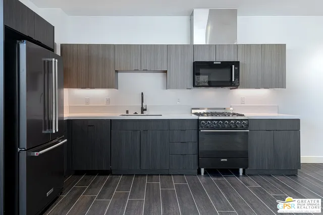 a kitchen with a refrigerator and a sink