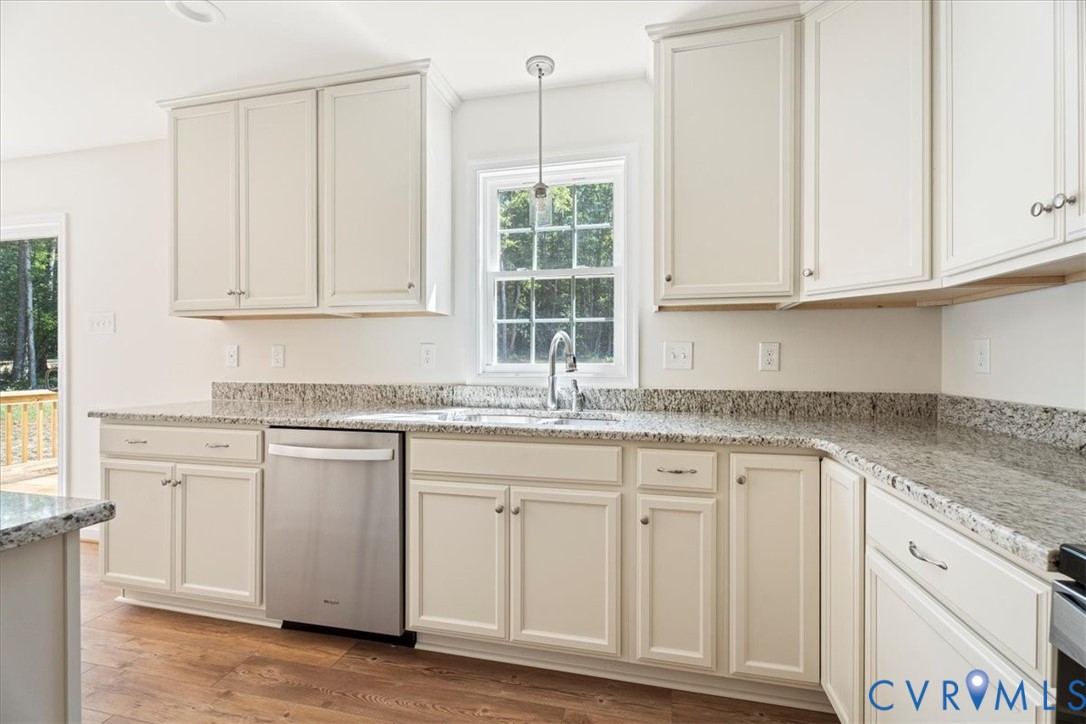 160 Ashburn Road Cumberland, VA 23040 - Photo 16 of 45 a kitchen with granite countertop white cabinets and a window