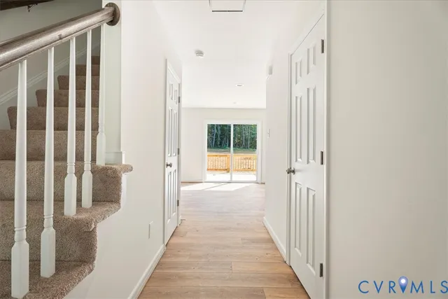 a view of a hallway with windows