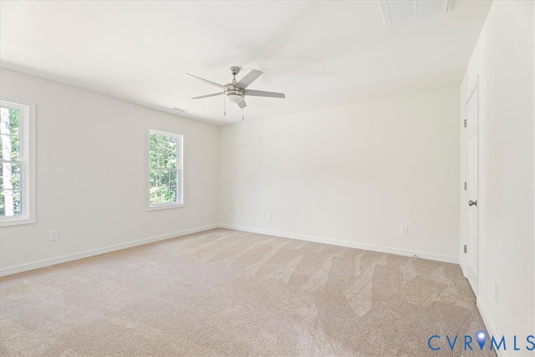 160 Ashburn Road Cumberland, VA 23040 - Photo 35 of 45 an empty room with windows and fan