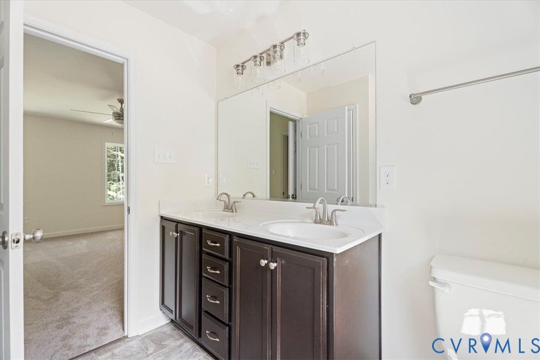 160 Ashburn Road Cumberland, VA 23040 - Photo 37 of 45 a bathroom with a sink and a mirror