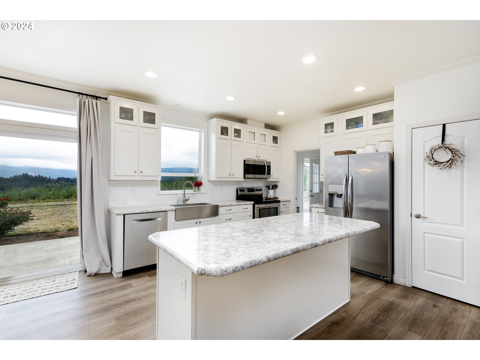 19376 Southeast Chambers Road Sandy, OR 97055 - Photo 13 of 48 a kitchen with stainless steel appliances granite countertop a refrigerator a sink and a stove