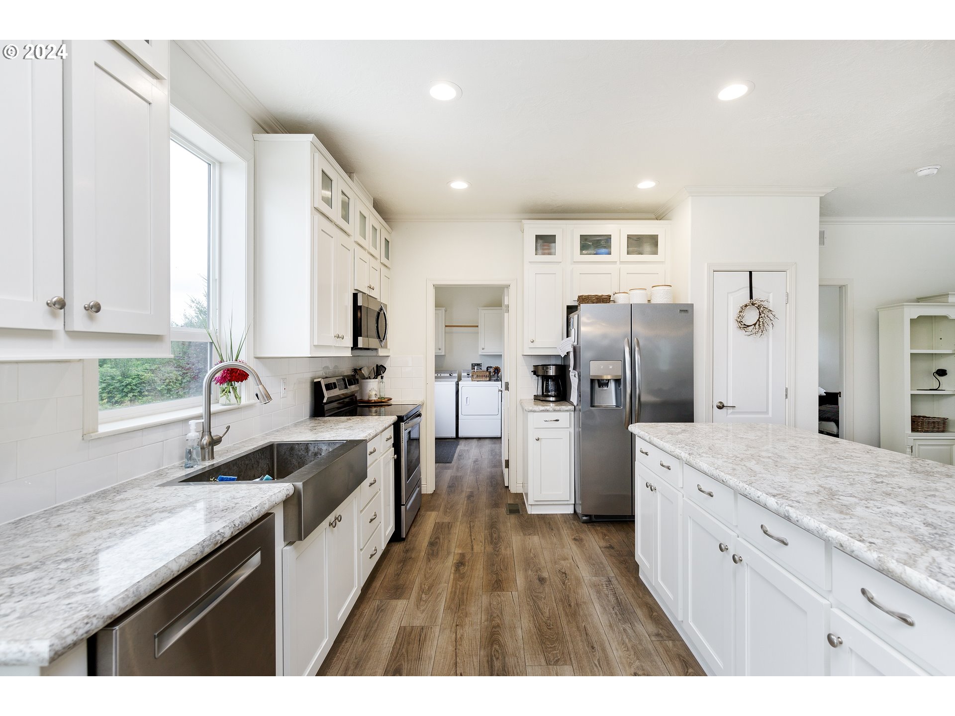 19376 Southeast Chambers Road Sandy, OR 97055 - Photo 14 of 48 a kitchen with white cabinets and stainless steel appliances