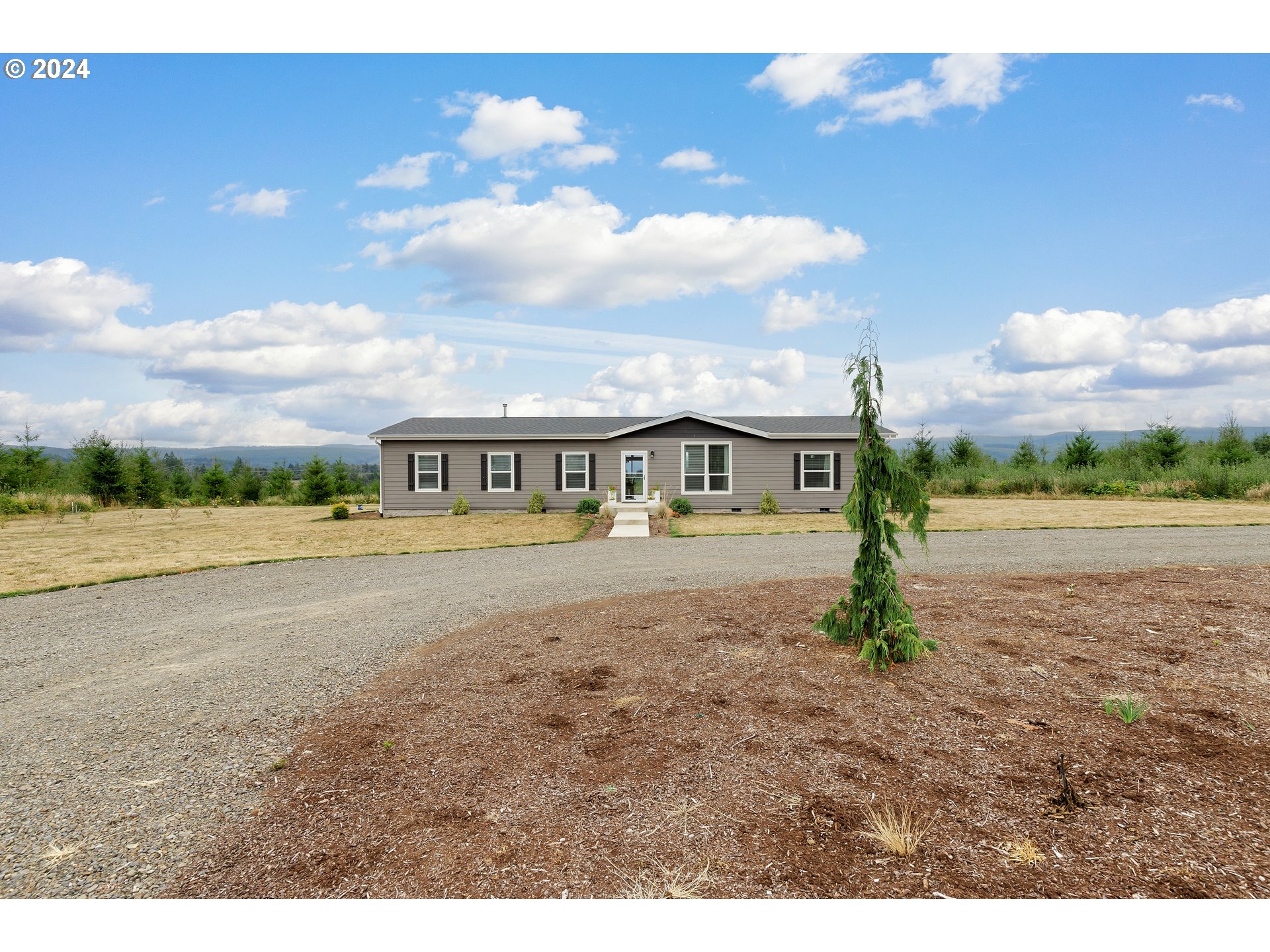 19376 Southeast Chambers Road Sandy, OR 97055 - Photo 4 of 48 a view of an house with outdoor space and balcony