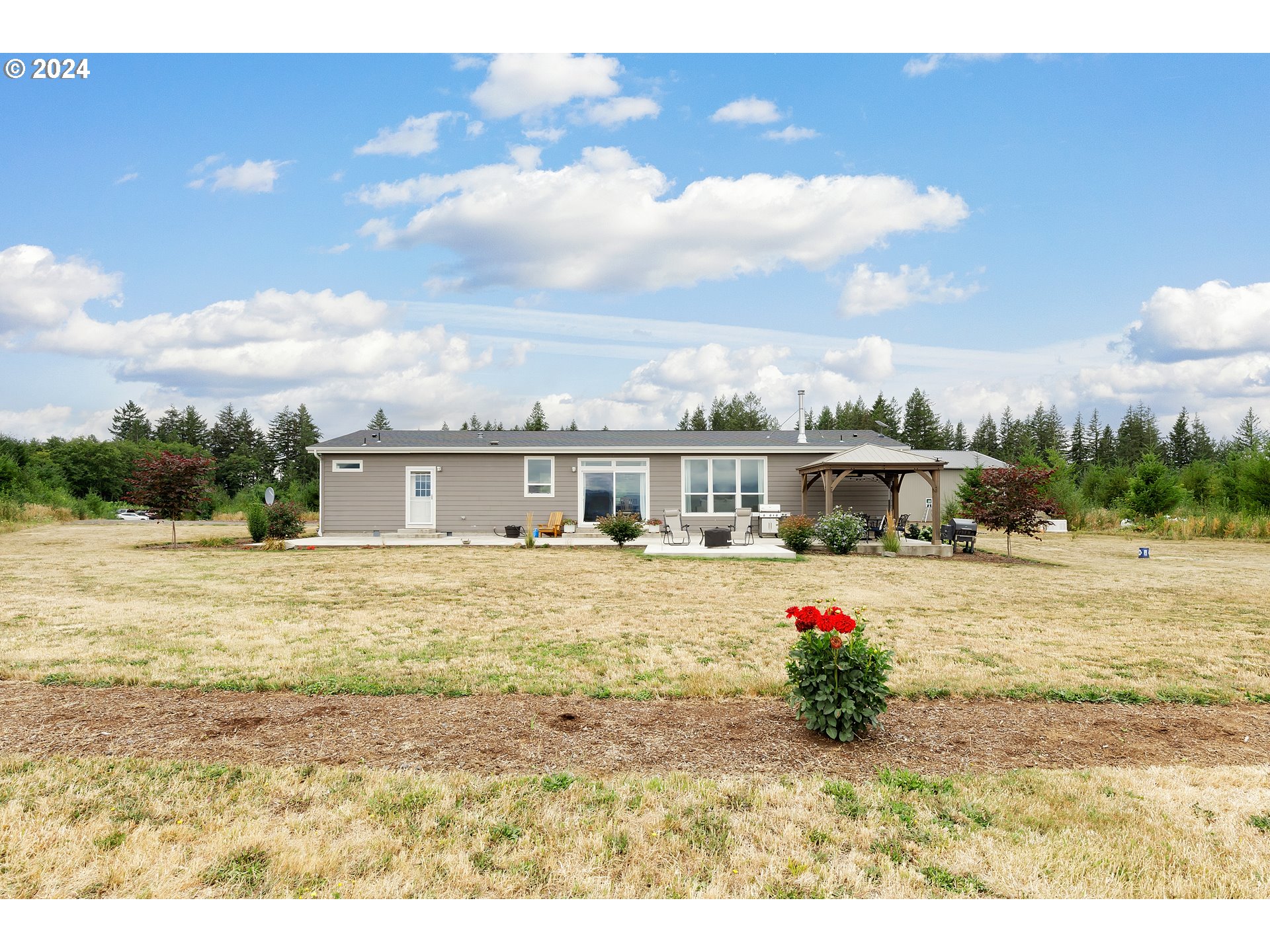 19376 Southeast Chambers Road Sandy, OR 97055 - Photo 5 of 48 a view of a house with a swimming pool