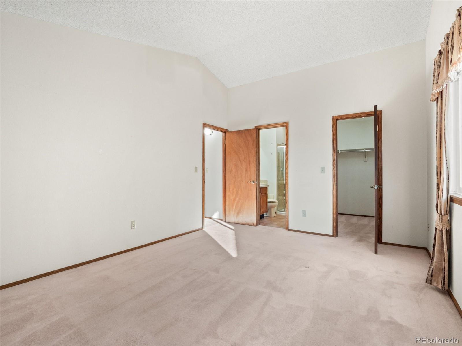 10016 Raritan Way Thornton, CO 80260 - Photo 22 of 43 an empty room with windows