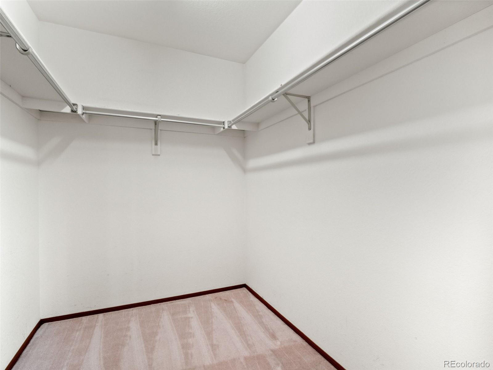 10016 Raritan Way Thornton, CO 80260 - Photo 23 of 43 a view of a room with racks on the wall