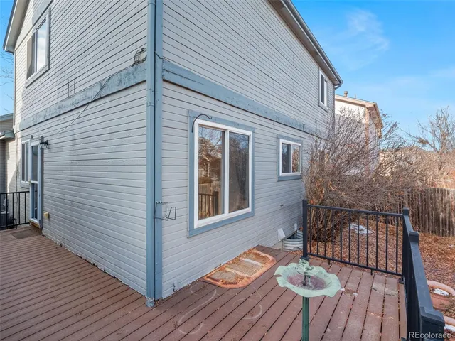 a view of a house with backyard and wooden floor